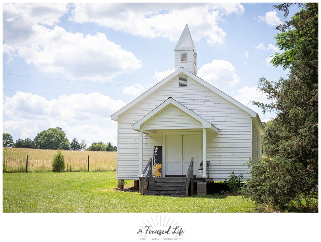Intimate white chapel summer wedding at Foster Brady Farm in Monroe, GA by Georgia wedding photographers A Focused Life Photography