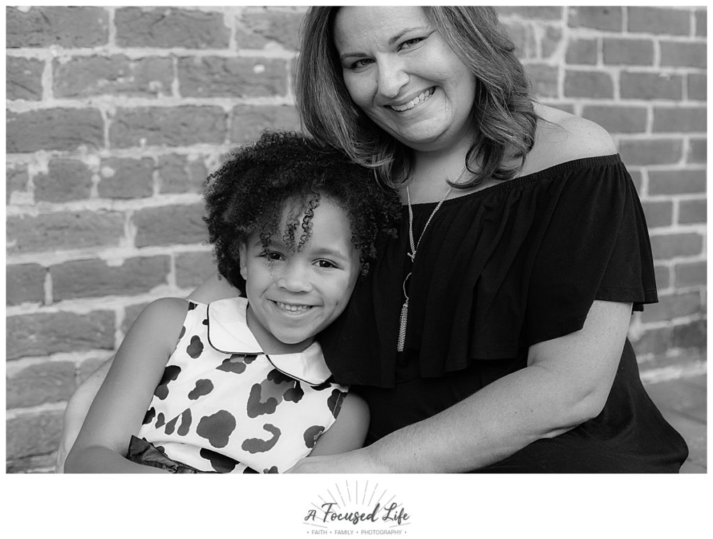 A Focused Life Photography Marietta Square Family Photographer Girl in Leopard Dress with Mom