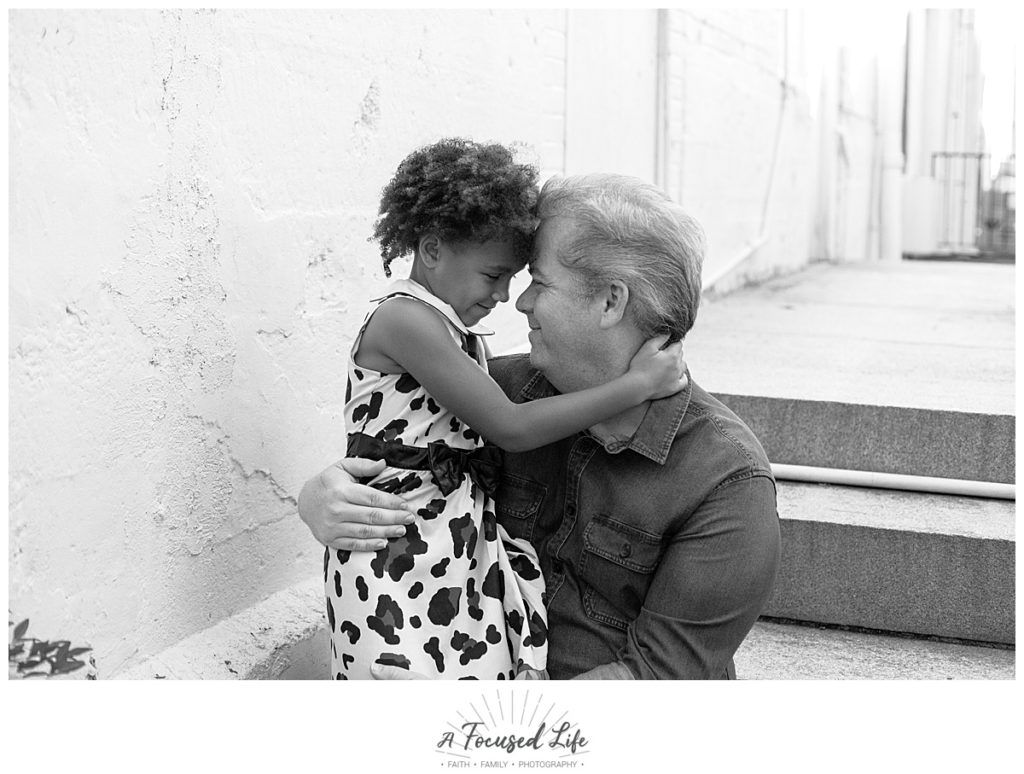 A Focused Life Photography Marietta Square Family Photographer Girl in Leopard Dress with Dad