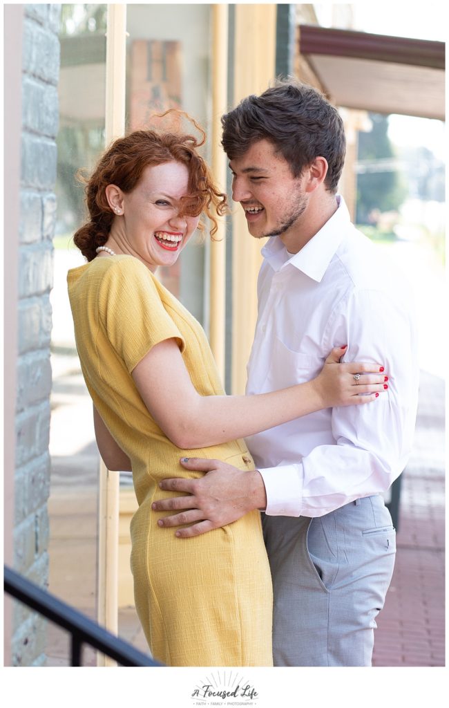 Red head girl wearing mustard yellow dress in engagement session