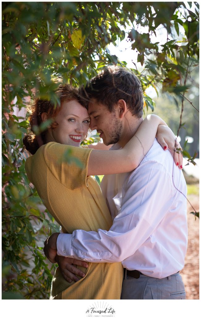 Romantic shot with couple in greenery