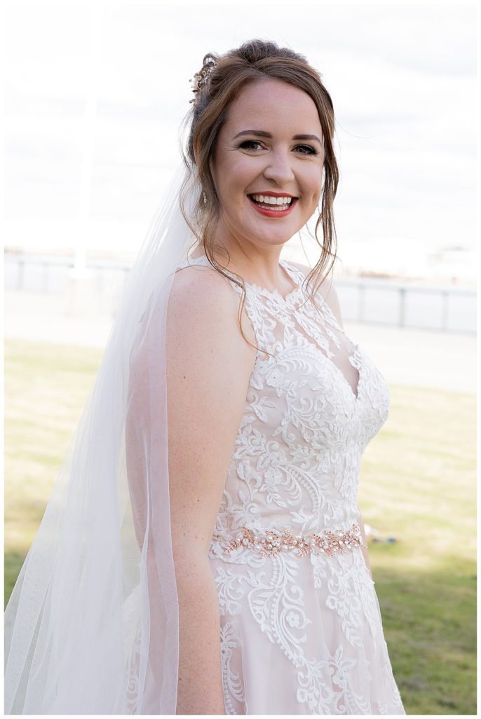 Brunette Bride in lace gown at Cooper Riverside Park in Mobile, AL