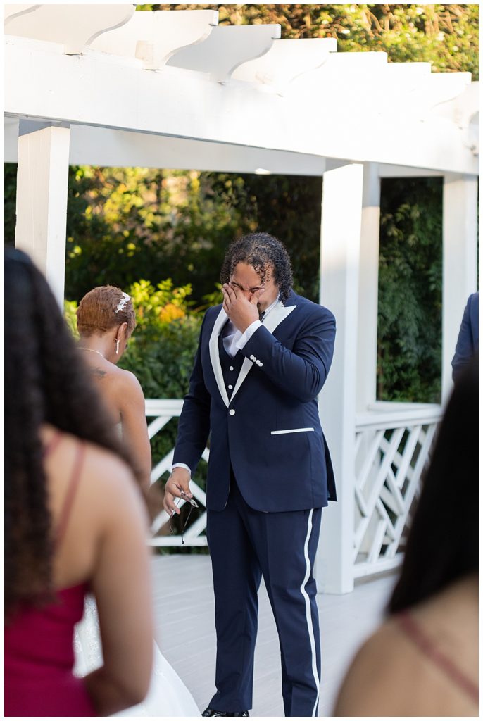 Groom getting emotional with his bride on wedding day